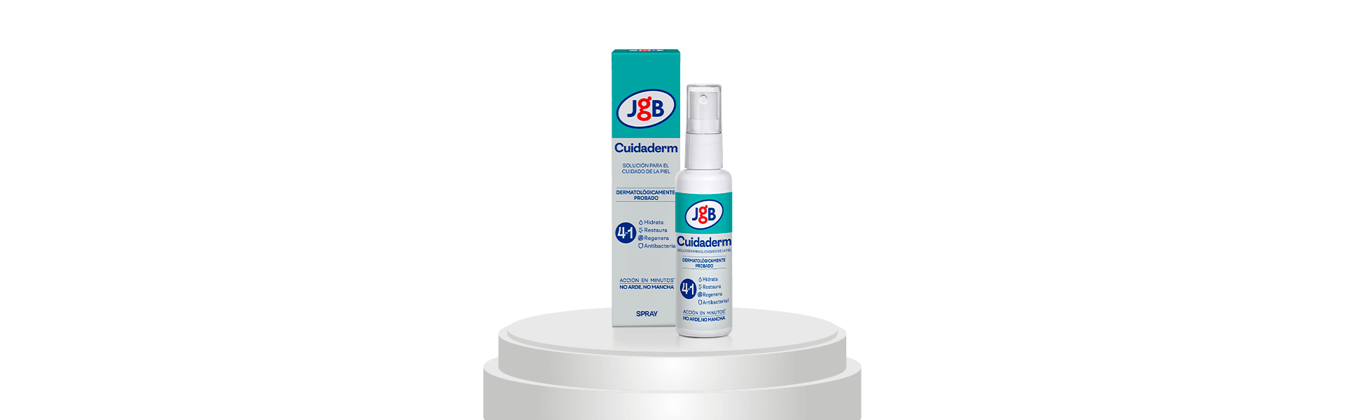 Caja y frasco spray de Cuidaderm JGB colocados sobre un pedestal blanco con fondo gris claro